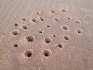 Fototapeta na wymiar Creation on sand