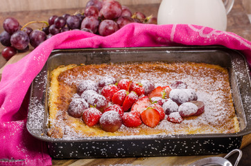 Pancake cooking in a plate with fruit