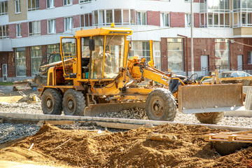 Grader working outside on road construction