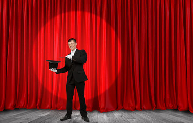 Businessman demonstrating magic . Mixed media