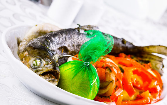 Grilled whole salmon with vegetables