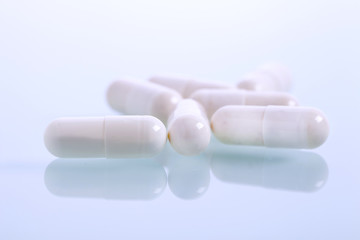 Set of capsules on white background