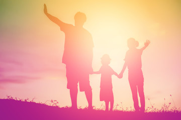 silhouette of a happy family and happy time sunset