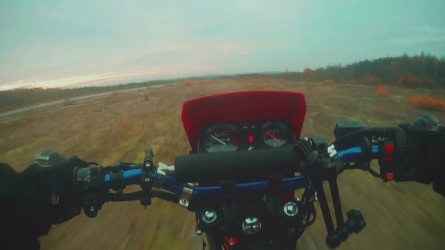 Enduro rider in motorcycle  riding on dirt track