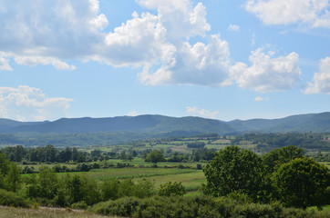 Landscape of central Serbia with fields and mountain in background