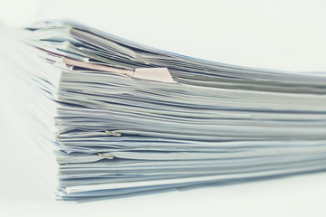 Stack of business report paper files