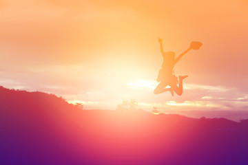 Silhouette of woman praying over beautiful sky background