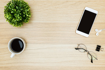 Wood office desk table with supplies. Top view with copy space, flat lay.