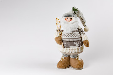 Santa Clause statue soft with snow shoe on white background framed right