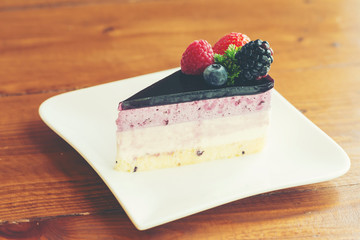 fruit cake with berries on white plate