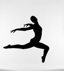Fototapeta na wymiar Silhouette of jumping female ballet dancer 