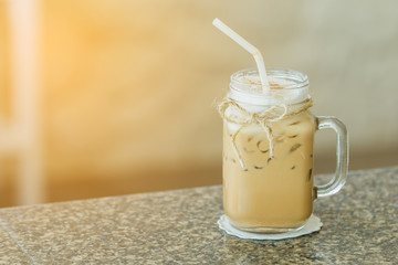 Fresh ice coffee in big glass with sunshine