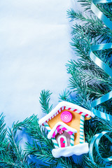 Christmas background with firtree branch and house