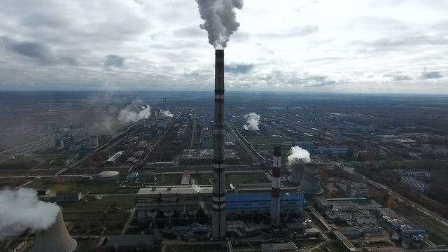 Smoke from industrial factories and plants. Environmental pollution. Aerial. 4K