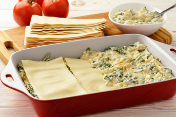 Lasagna with spinach, ricotta and feta. Cooking process.