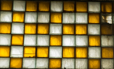  background pattern of dirty yellow and white glass tiles