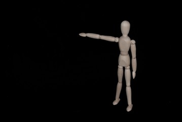 Moody wooden figure instructing 