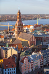 Fototapeta premium Riga Cathedral, Daugava river beautuful old town buildings, aerial summer day view of old town from St Peter church, Latvia. Vertical shot