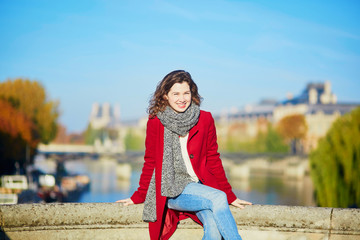 Young girl walking in Paris on a sunny fall day