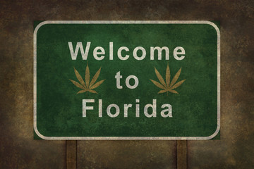 Welcome to Florida with marijuana leaf, roadside sign with ominous background