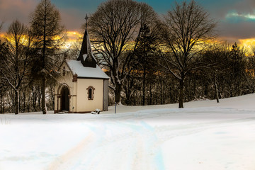 Fototapeta na wymiar Small Chapel in Winter dawn