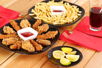 Grilled chicken on a plate standing the wooden table