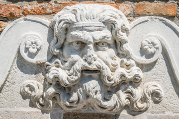 Ancient stone fountain depicting the god Neptune.