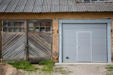 Fototapeta na wymiar Two garage doors on house