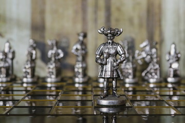 Obraz premium Metal chess. Beautiful and unusual chess pieces. Vintage background.
