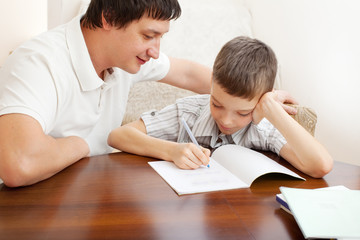 Fototapeta na wymiar Father helping son do homework