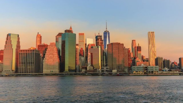 View to Manhattan skyline from Brooklyn Bridge Park  in the morning time lapse