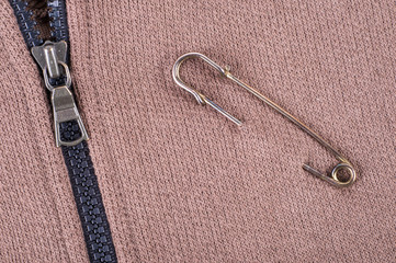 Safety pins on clothes as a symbol of solidarity