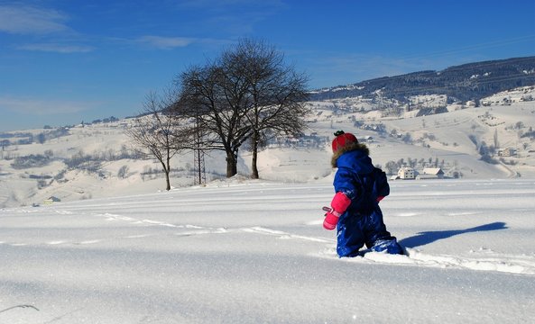 child stomping through the snow