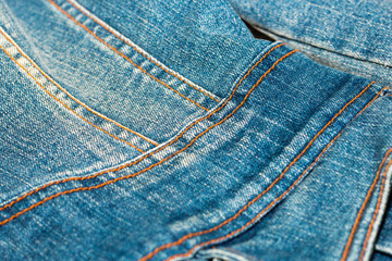 Blue jean or denim on wooden desk,make pattern background,make from cotton,bag of jean
