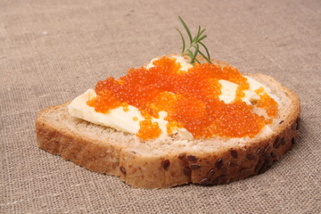Rye bread with butter and red caviar
