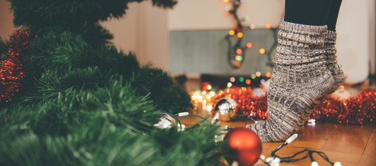 Woman decorating a christmas tree