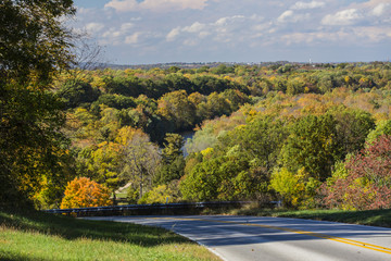 Hilltop road and distant fall landscape