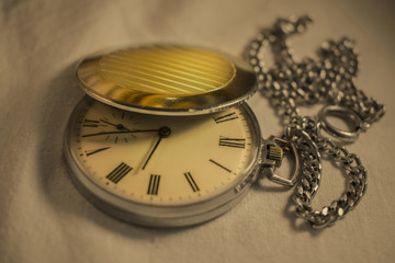 Old pocket watch in close-up view