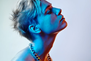 beauty woman with short color hair and blue light