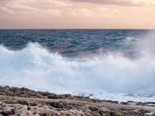 waves crashing on the rocks