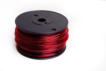 Top view of red translucent 3D printer filament spool