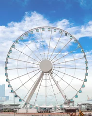 Foto auf Acrylglas Giant Ferris Wheel in Hong Kong Overlooking Victoria Harbor © ronniechua