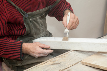 stonecutter in the studio brush a piece of marble