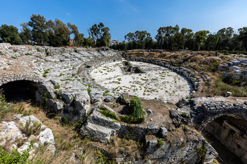Fototapeta na wymiar Roman amphitheater in Syracuse, Sicily, Italy dates back to the 1st century AD.