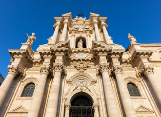 Fototapeta na wymiar The facade of the Cathedral of Syracuse, UNESCO World Heritage Site since 2005, was redesigned by architect Andrea Palma in 1725-1753, considered a relatively late example of High Sicilian Baroque.
