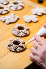 Decorating the traditional Christmas gingerbread cookies