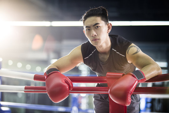 Boxer resting in boxing ring
