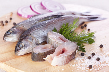 Lightly salted grayling on a chopping board