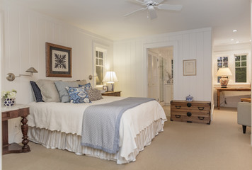 Bedroom interior with wooden furniture in traditional setting at night.