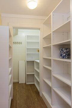 Compact Walk In Kitchen Pantry With Lots Of Shelves.